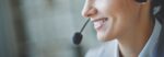 smiling-executive-using-headset